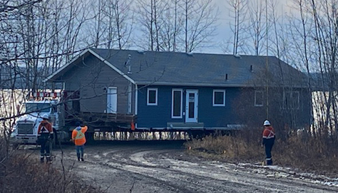 A new home, built by Nelson Lumber, being moved to Heart Lake First Nation in early November.